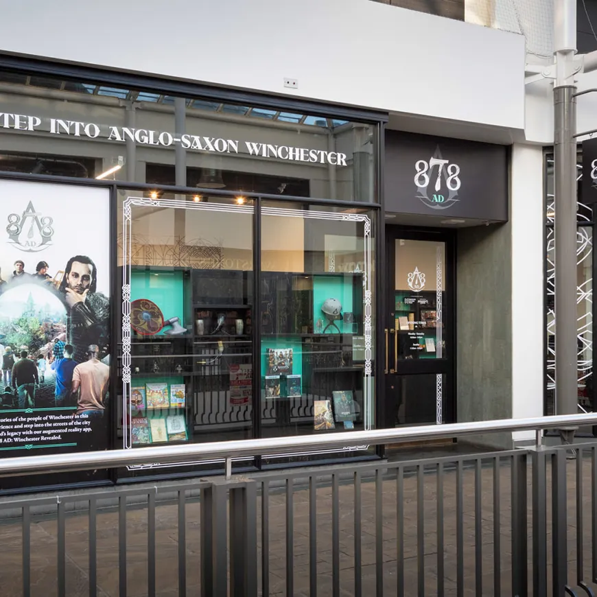 A shop front with 878 AD branding