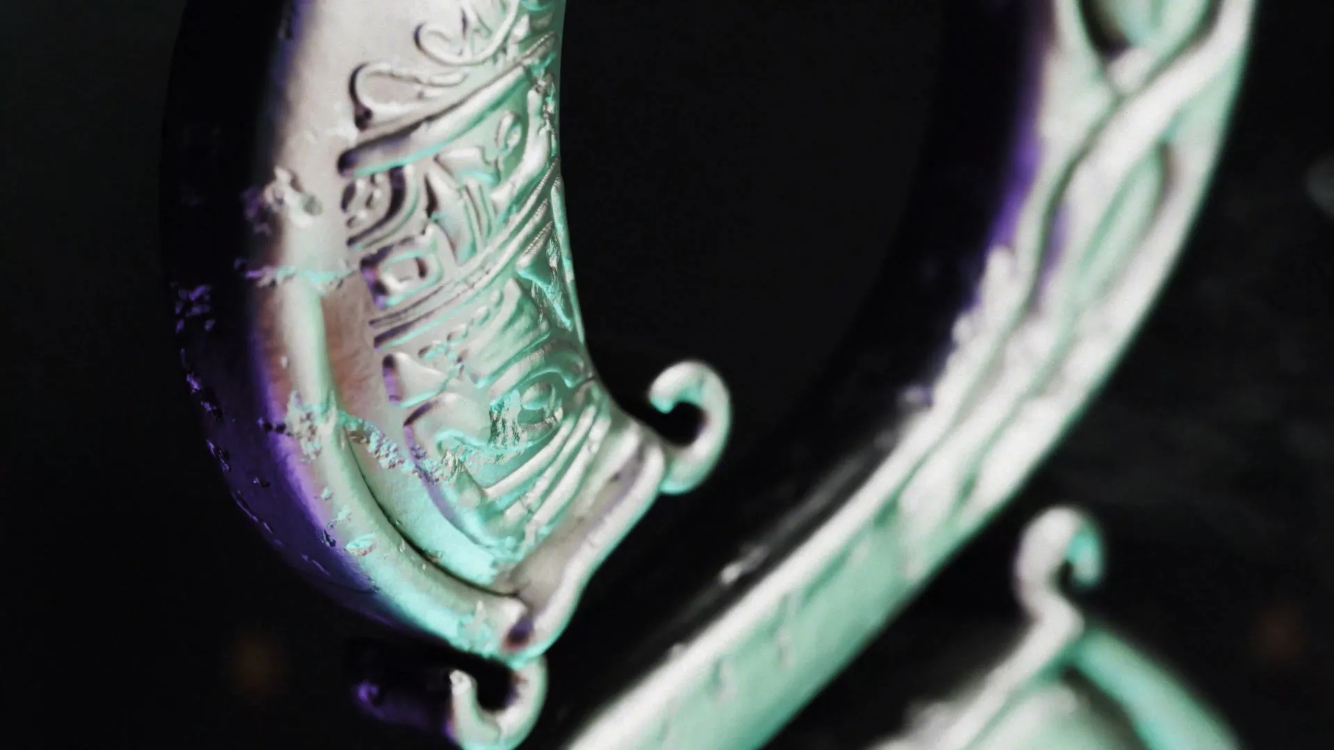 A still from an animation featuring a close up of a silver number with green and purple lighting