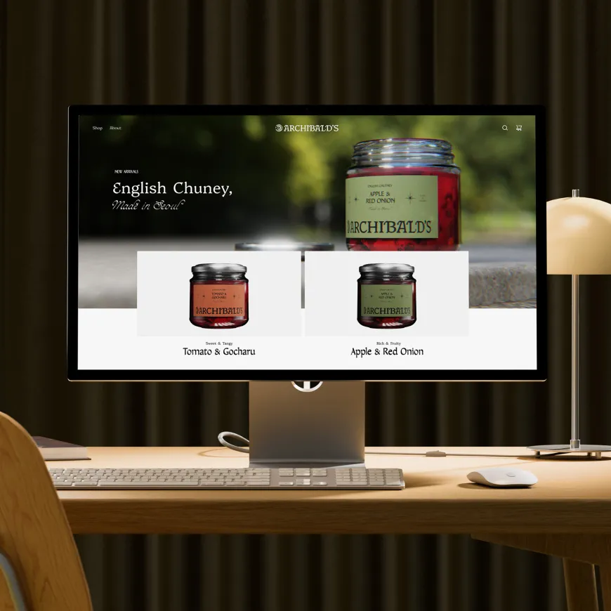 Desktop computer showcasing the Archibald’s chutney website on a modern wooden desk