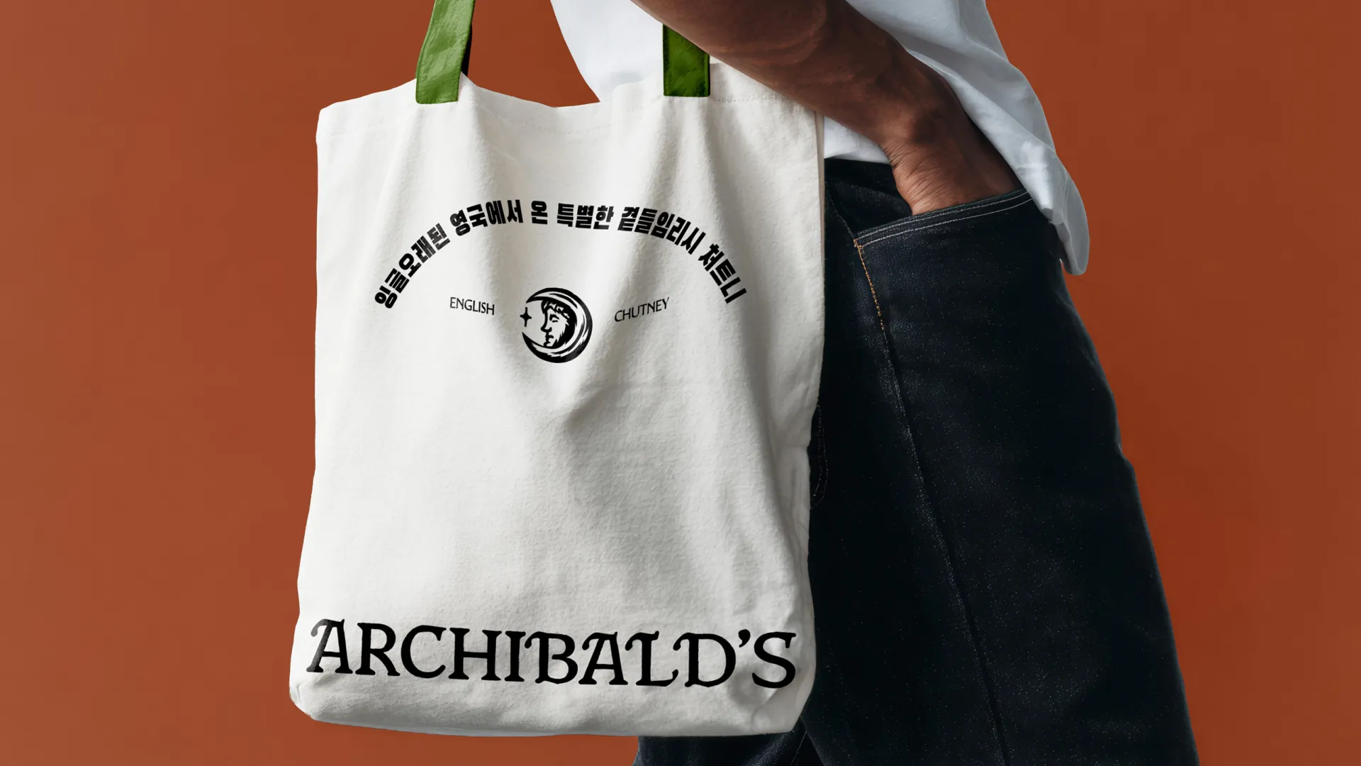Archibald's chutney branded tote bag over mans shoulder