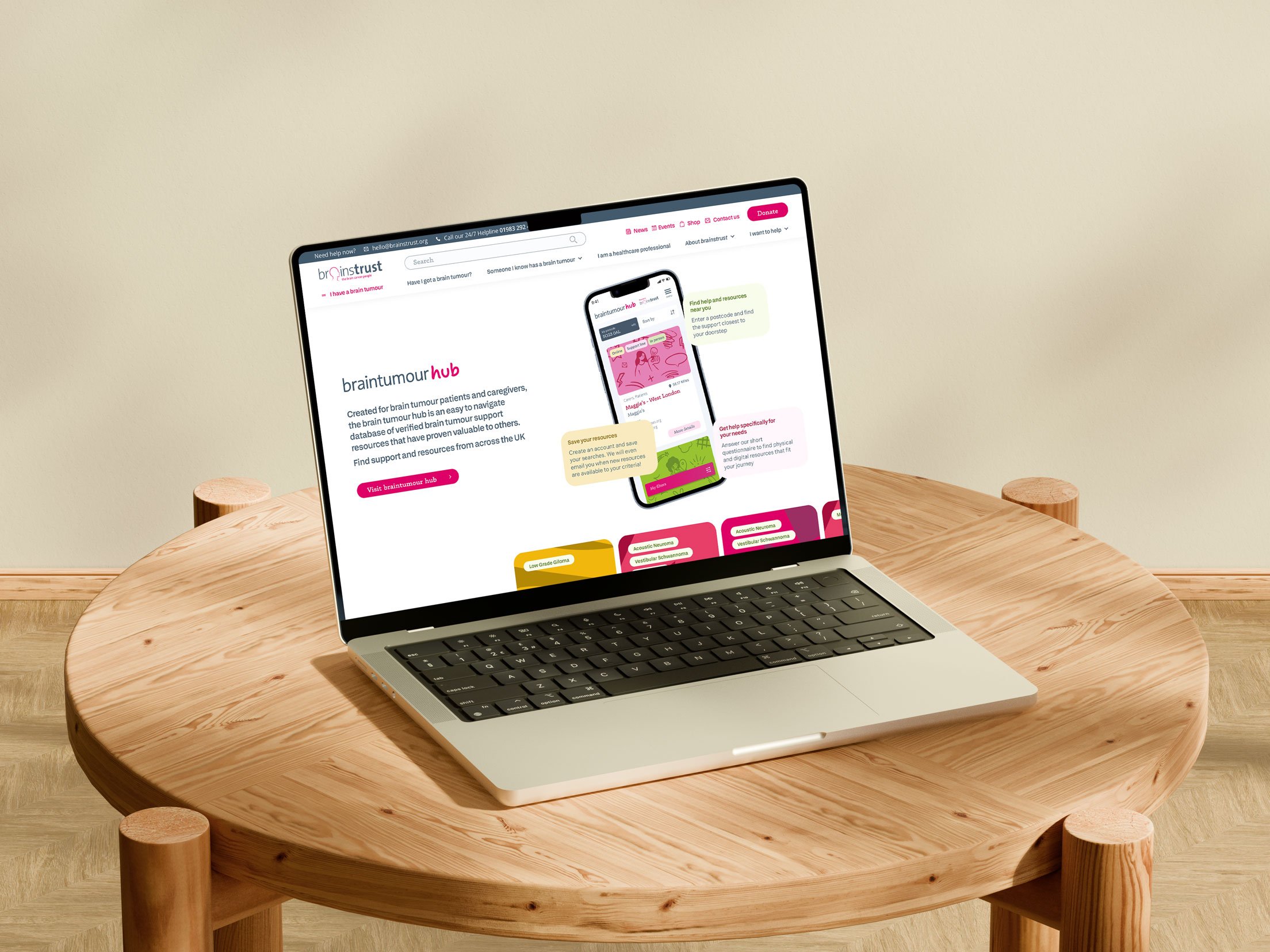 Laptop displaying the brain tumour hub advertisement on brainstrust website.