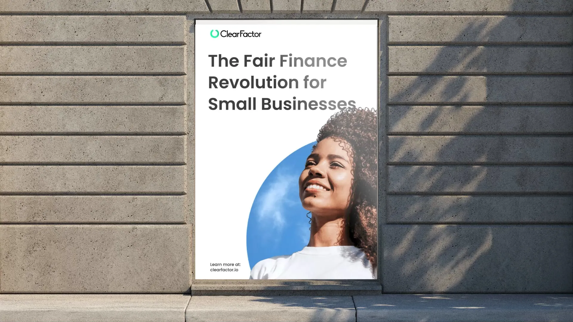 a stone wall with a white poster and text 'the fair finance revolution for small businesses'