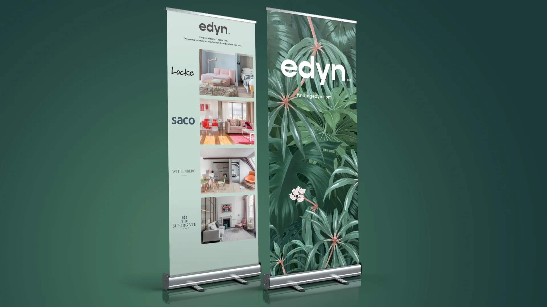 Tropical Edyn roller banners advertising different apartments on a deep green background.