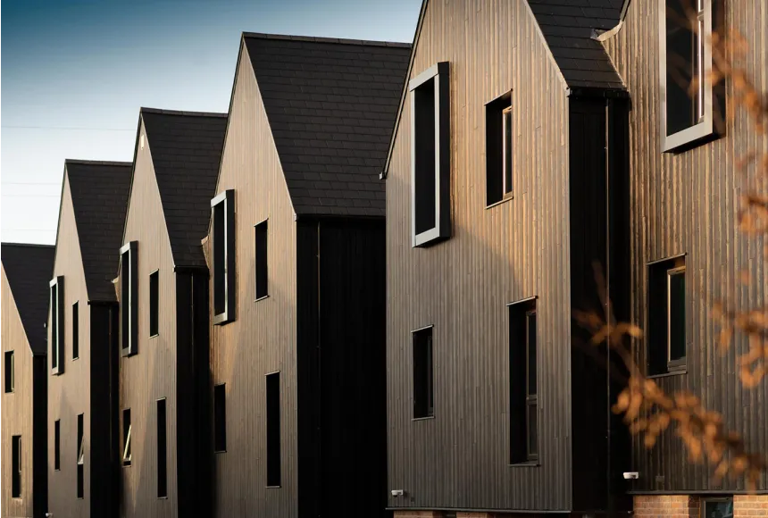 Row of houses built in the same wooden cladding