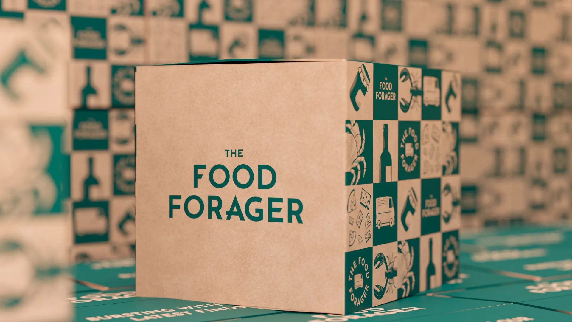 a close up of a wooden box, with green writing 'The Food Forager'