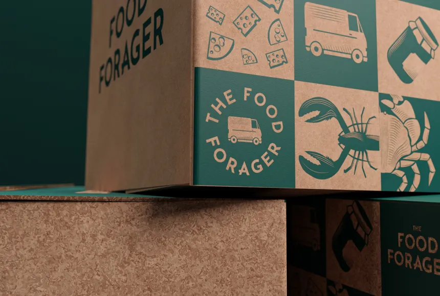 a tight close up of a cardboard box with green icons of lobsters and food