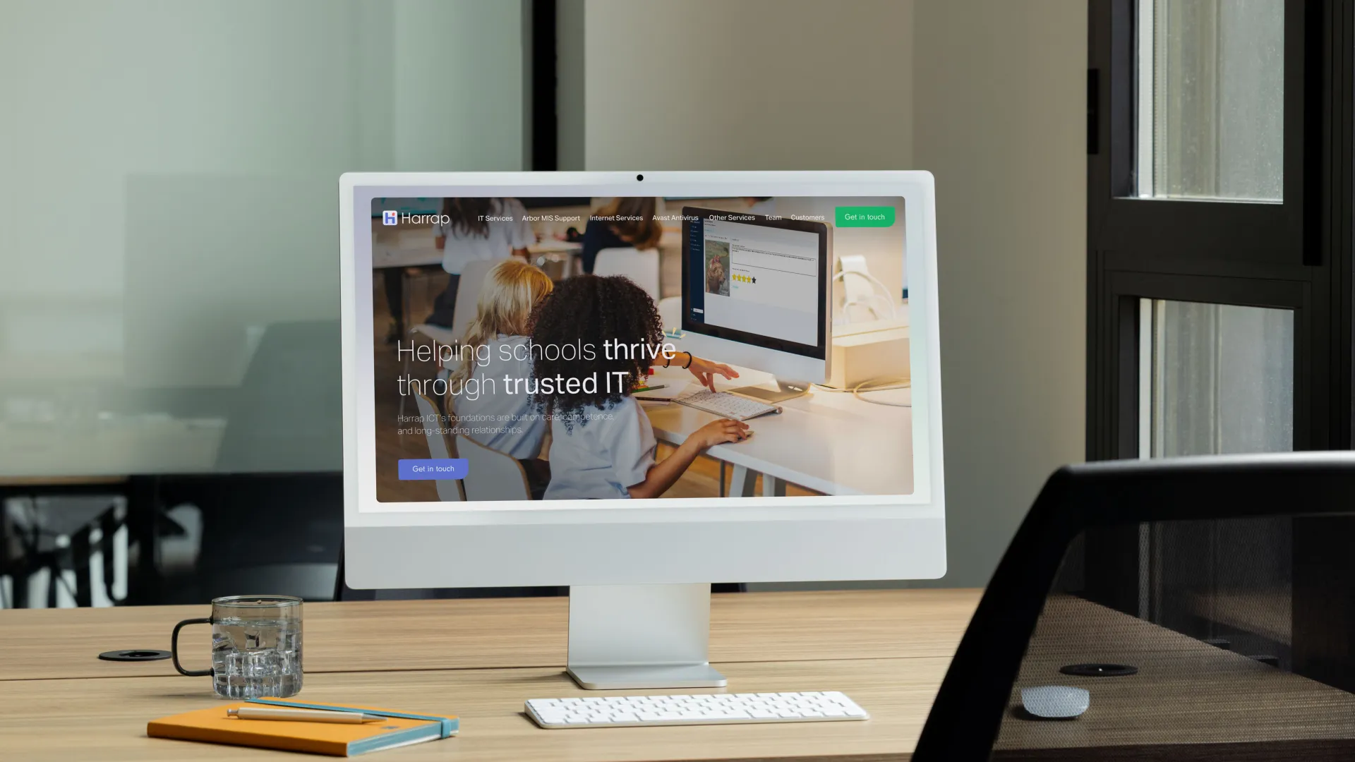 Desktop on a desk with Harrap website on display