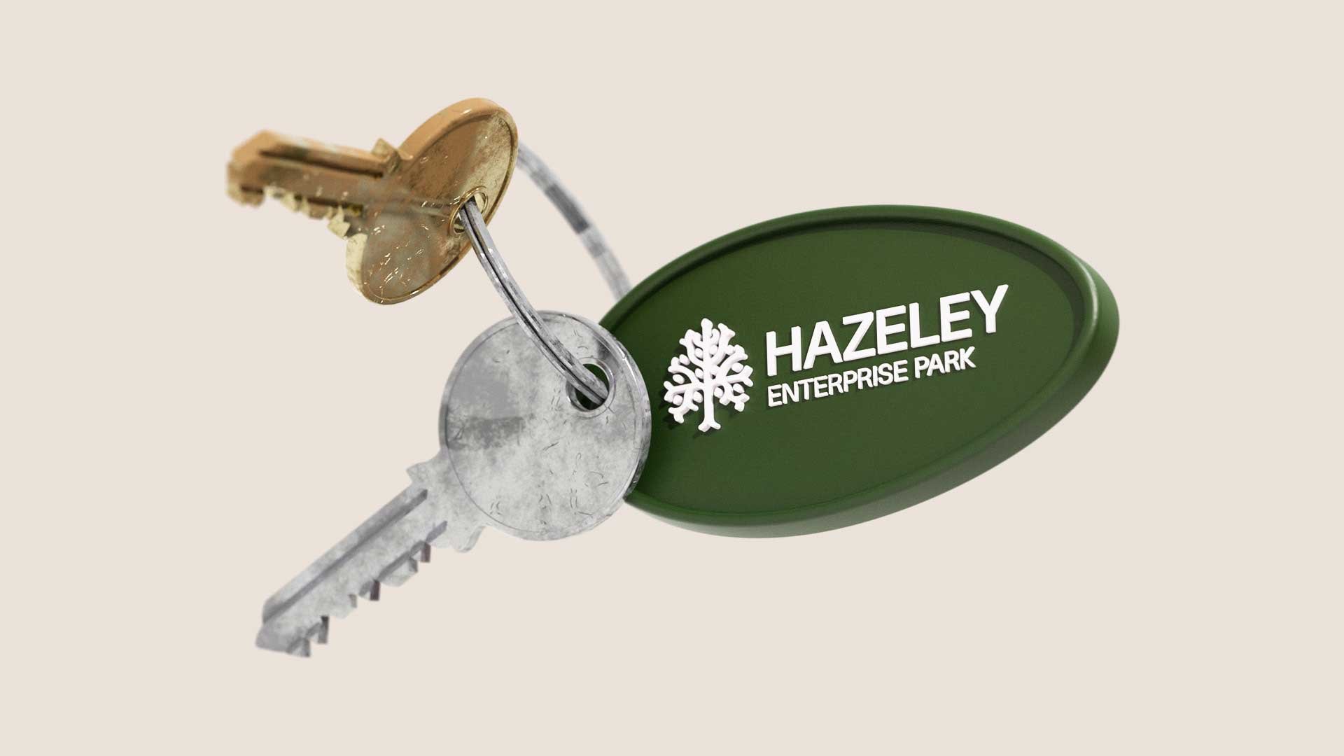 Keys with a Hazeley enterprise park green tag with logo embossed