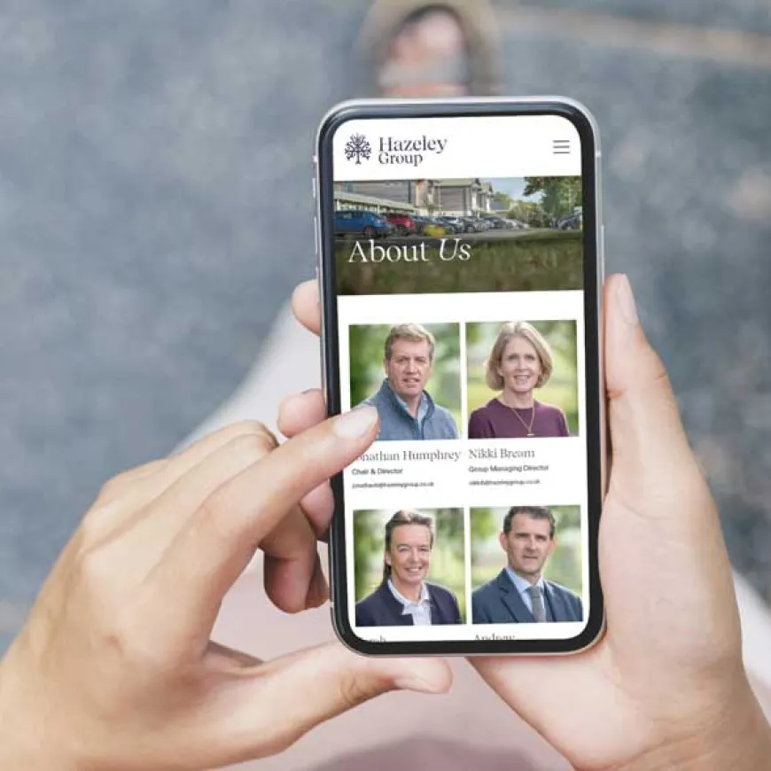 Person scrolling on mobile phone open on Hazeley about us page
