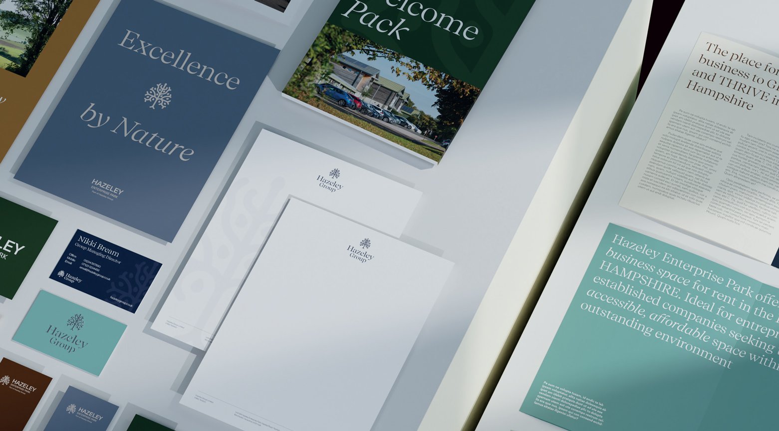 Collection of Hazeley Group printed materials showcasing brochures, stationery and business cards