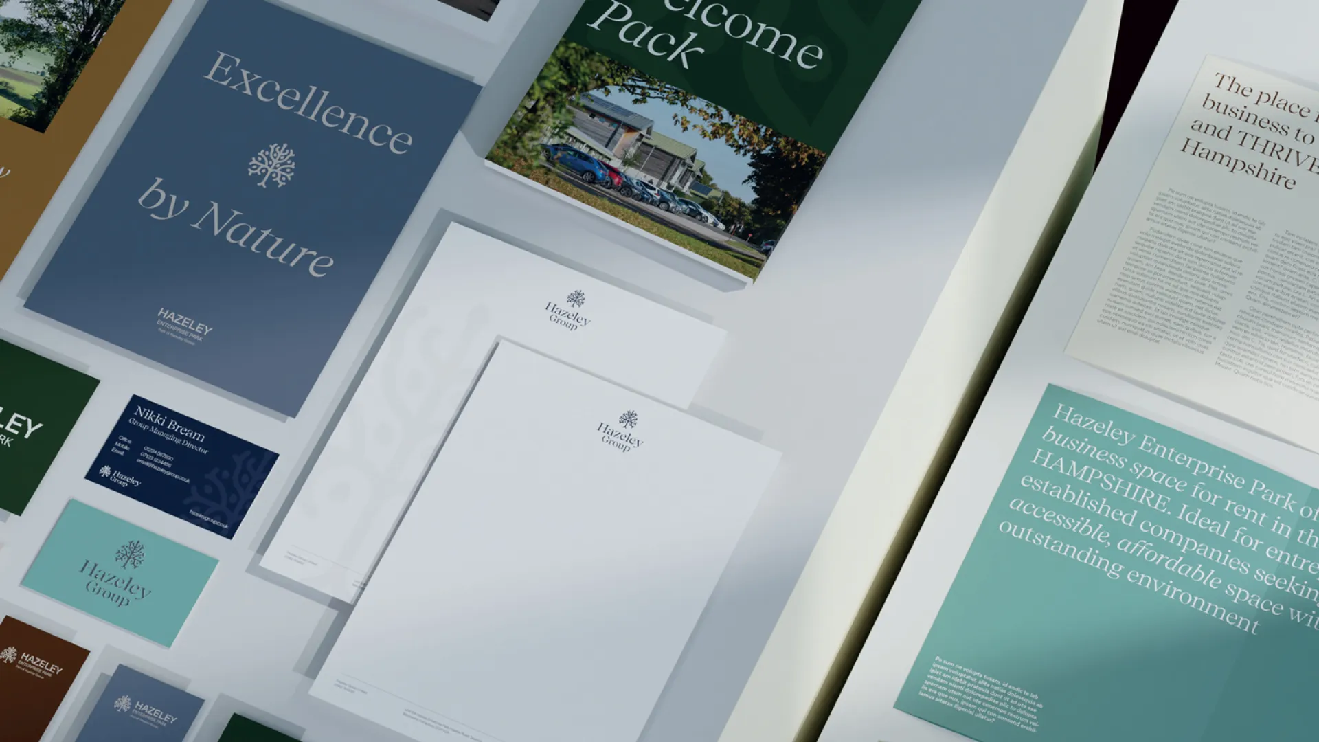Collection of Hazeley Group printed materials showcasing brochures, stationery and business cards