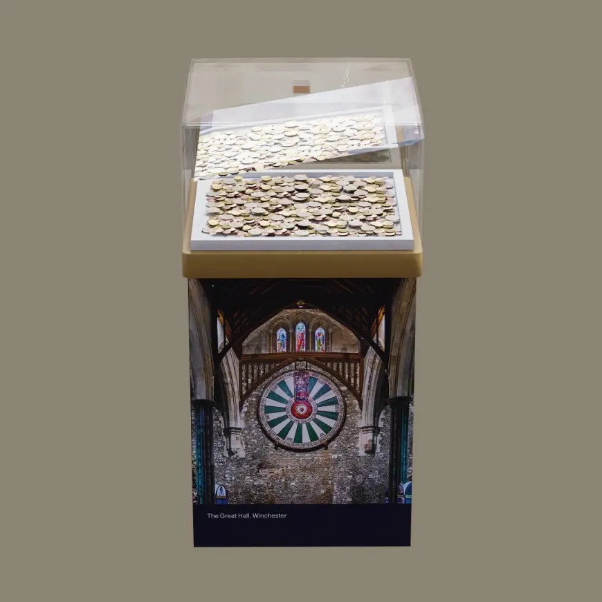 a light background with a mock up of a donation pillar featuring a photograph of the round table