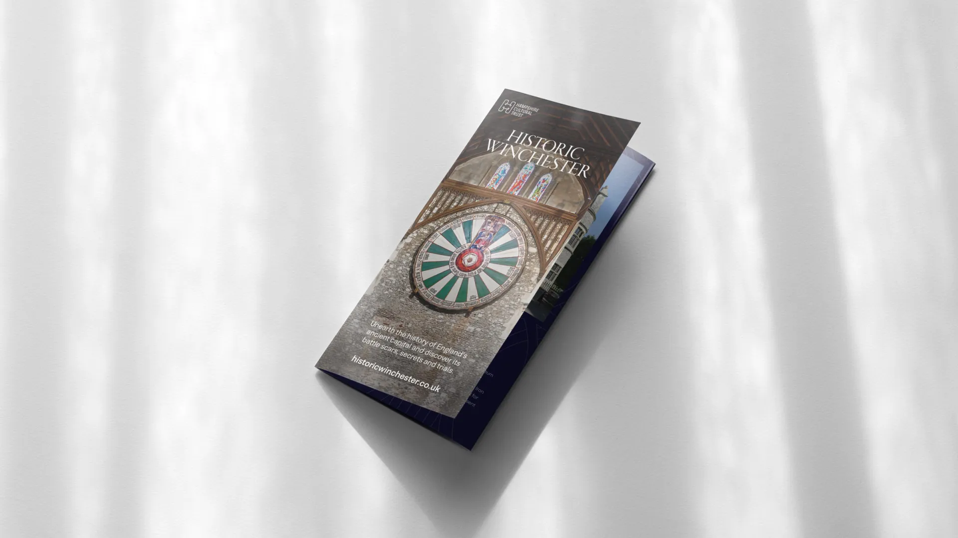 a folded leaflet with a photograph of the round table