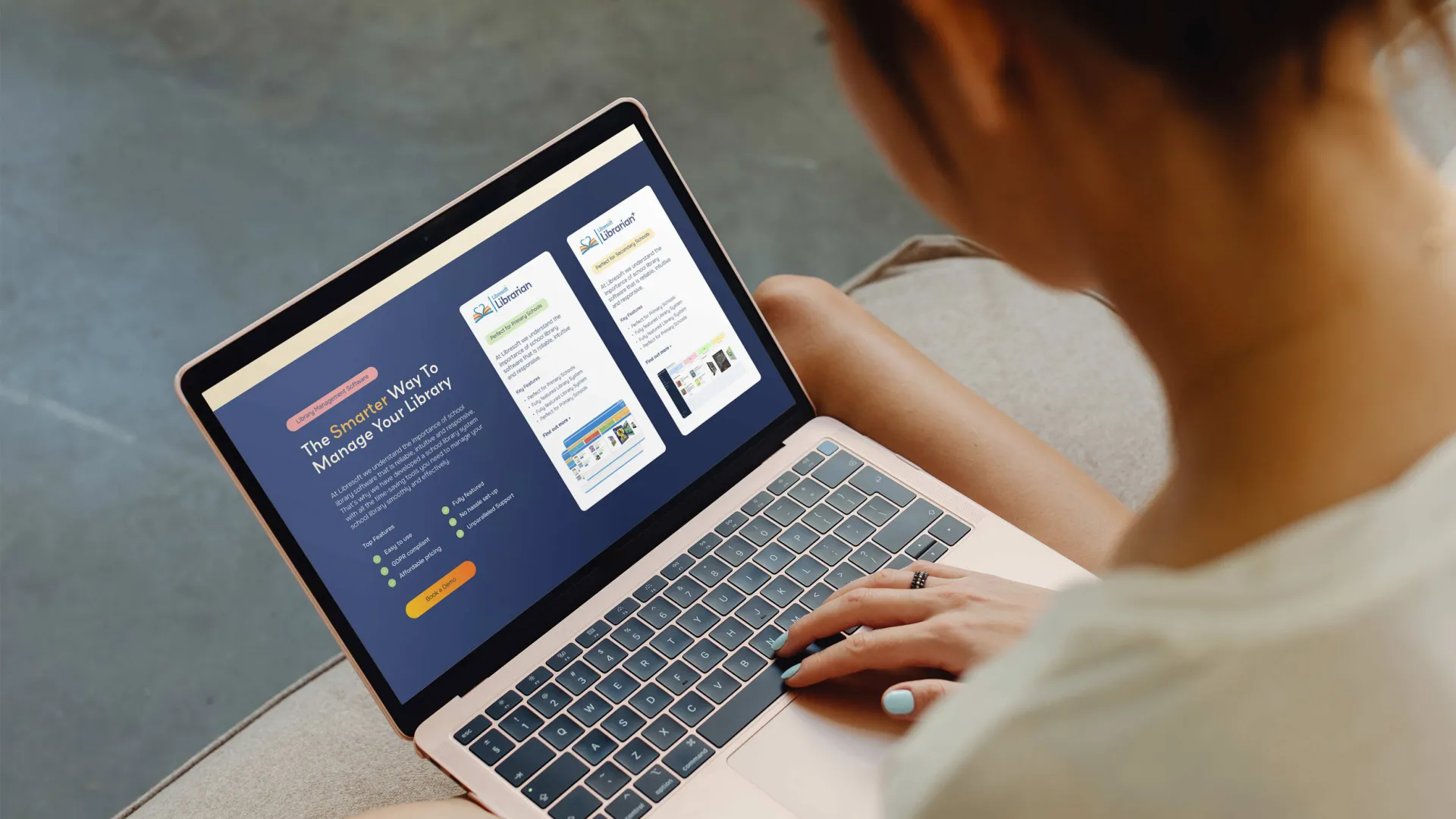 Woman holding laptop on her lap scrolling through Libresoft website