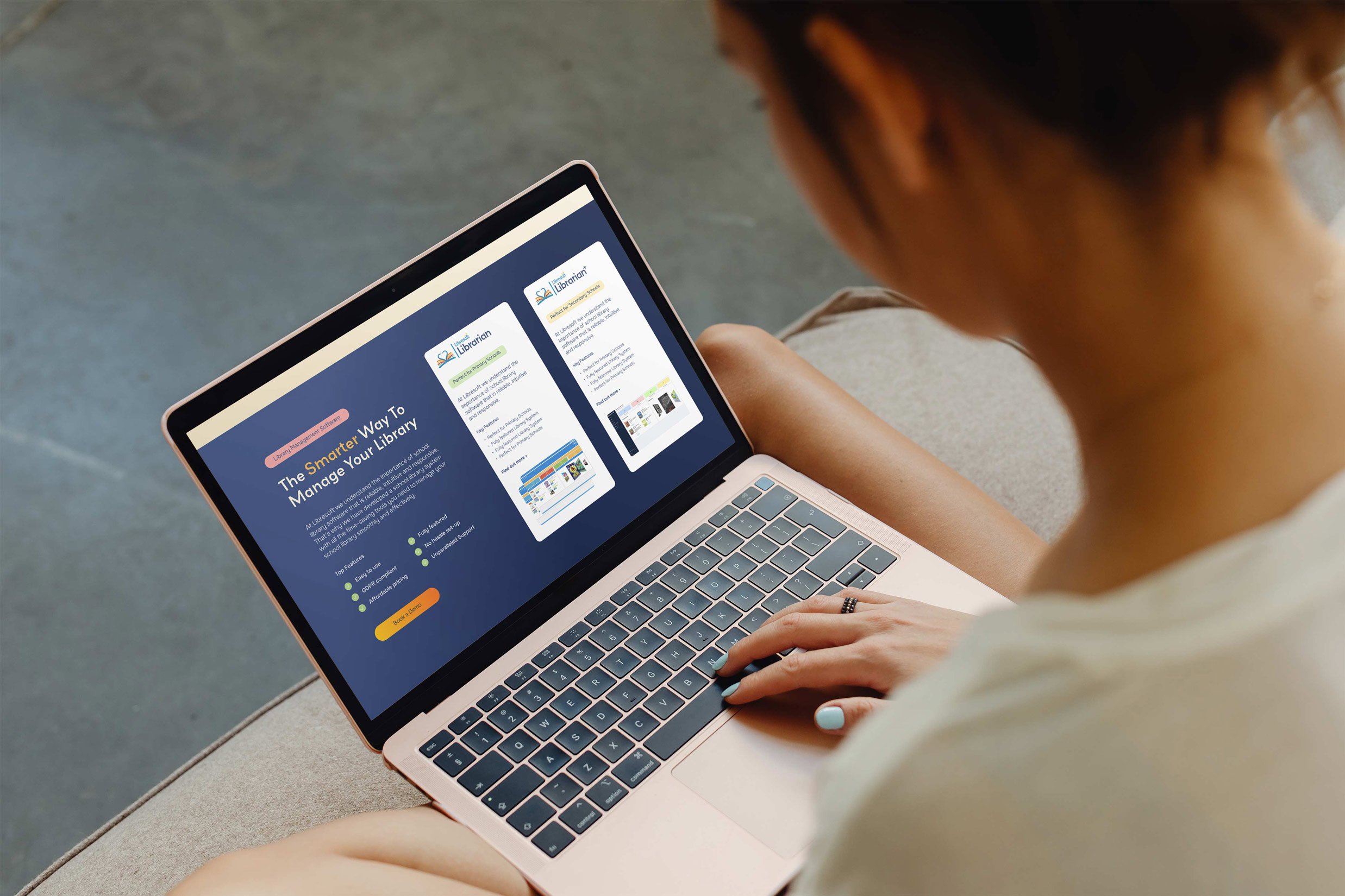 Woman holding laptop on her lap scrolling through Libresoft website