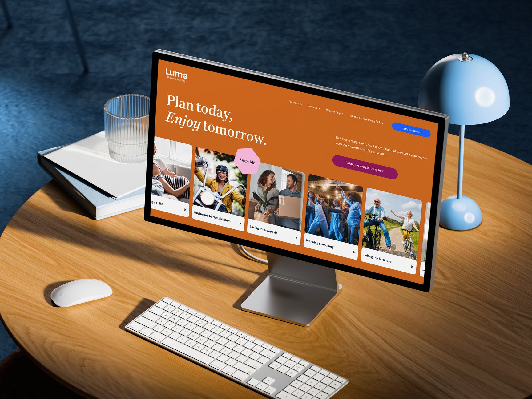 Desktop computer displaying the Luma Financial Planning website on a modern wooden desk