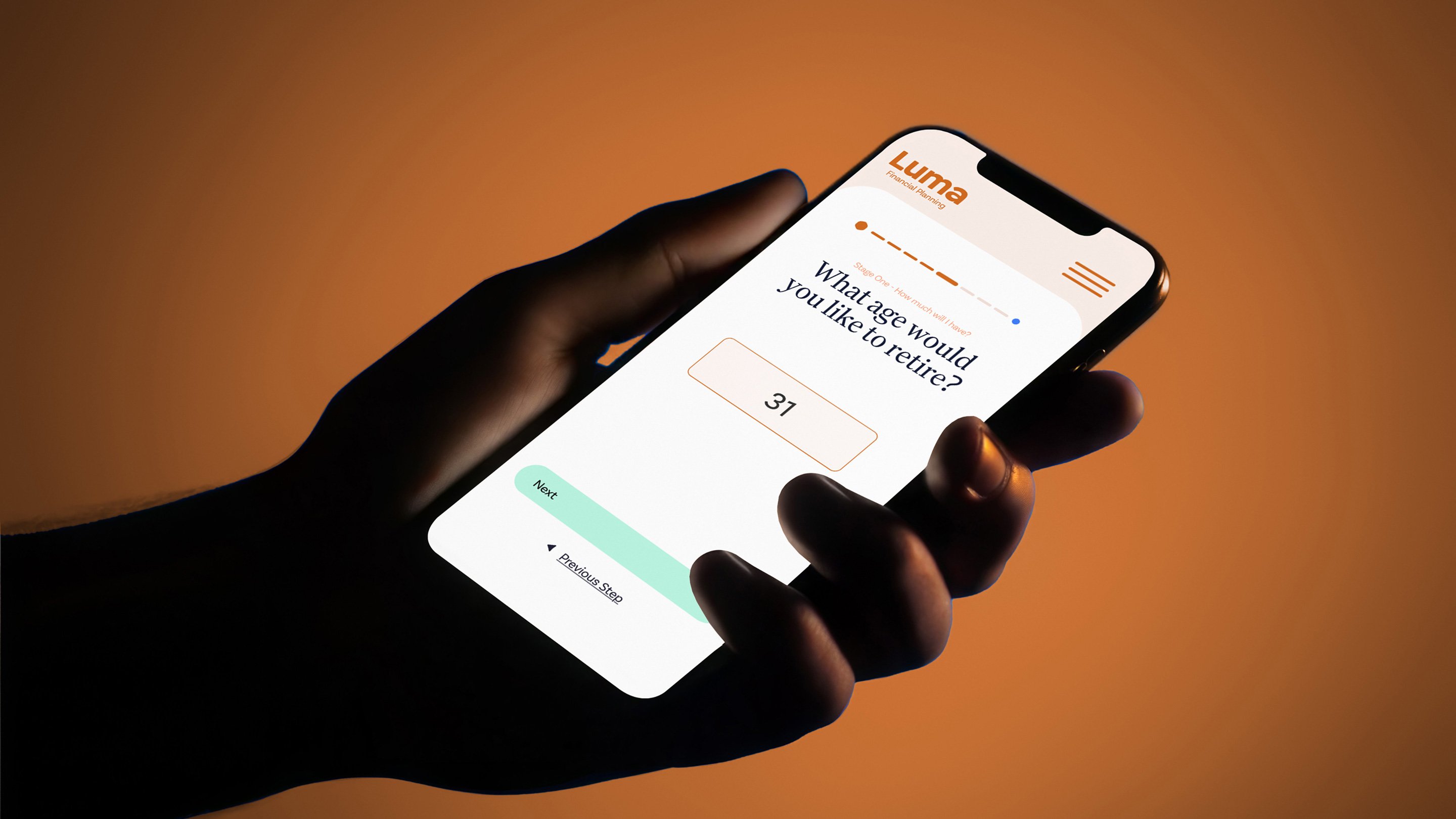 Hand holding a smartphone displaying the Luma Financial Planning retirement age calculator