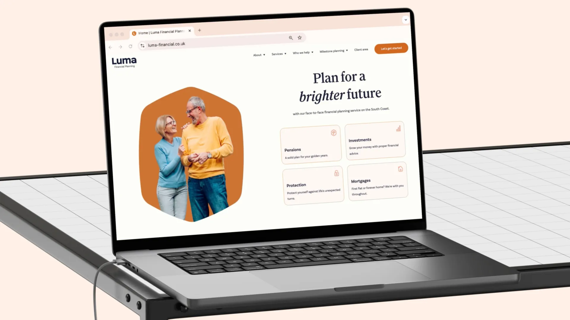 Laptop displaying the Luma Financial Planning website homepage and key financial services