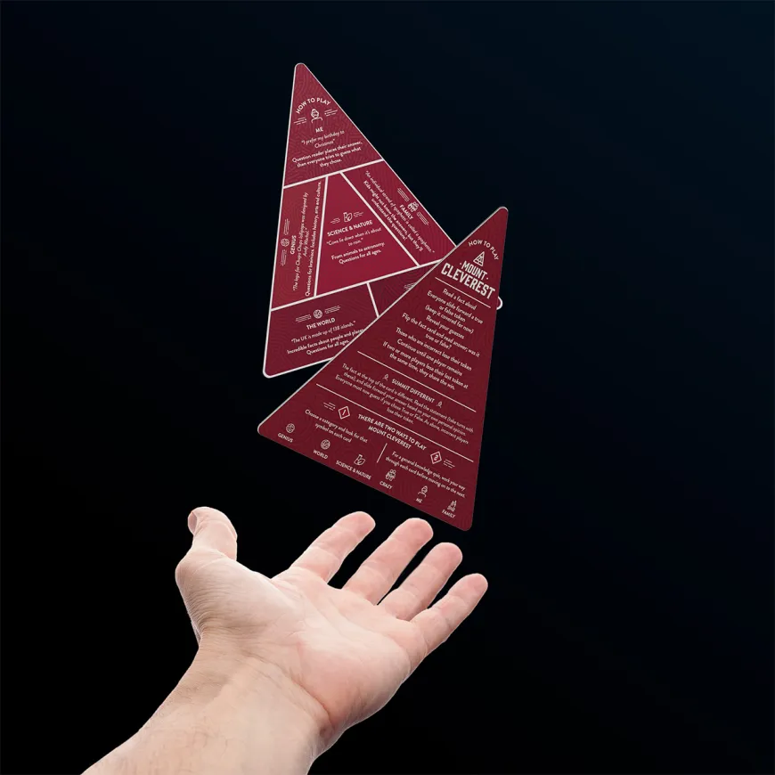 Hand reaching out with two red triangle games cards floating above
