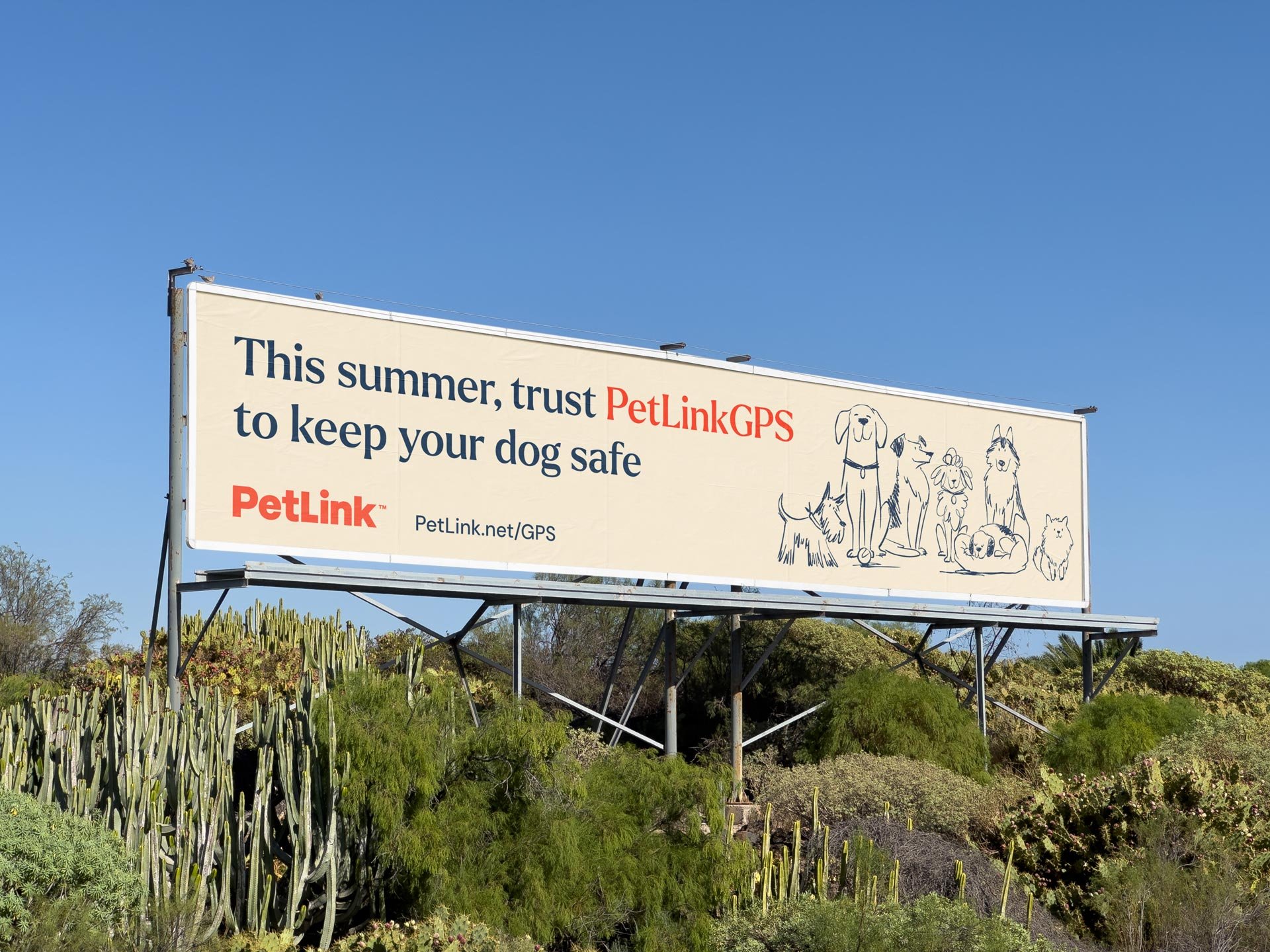 Billboard out in a cactus and shrub area advertising PetLink GPS.