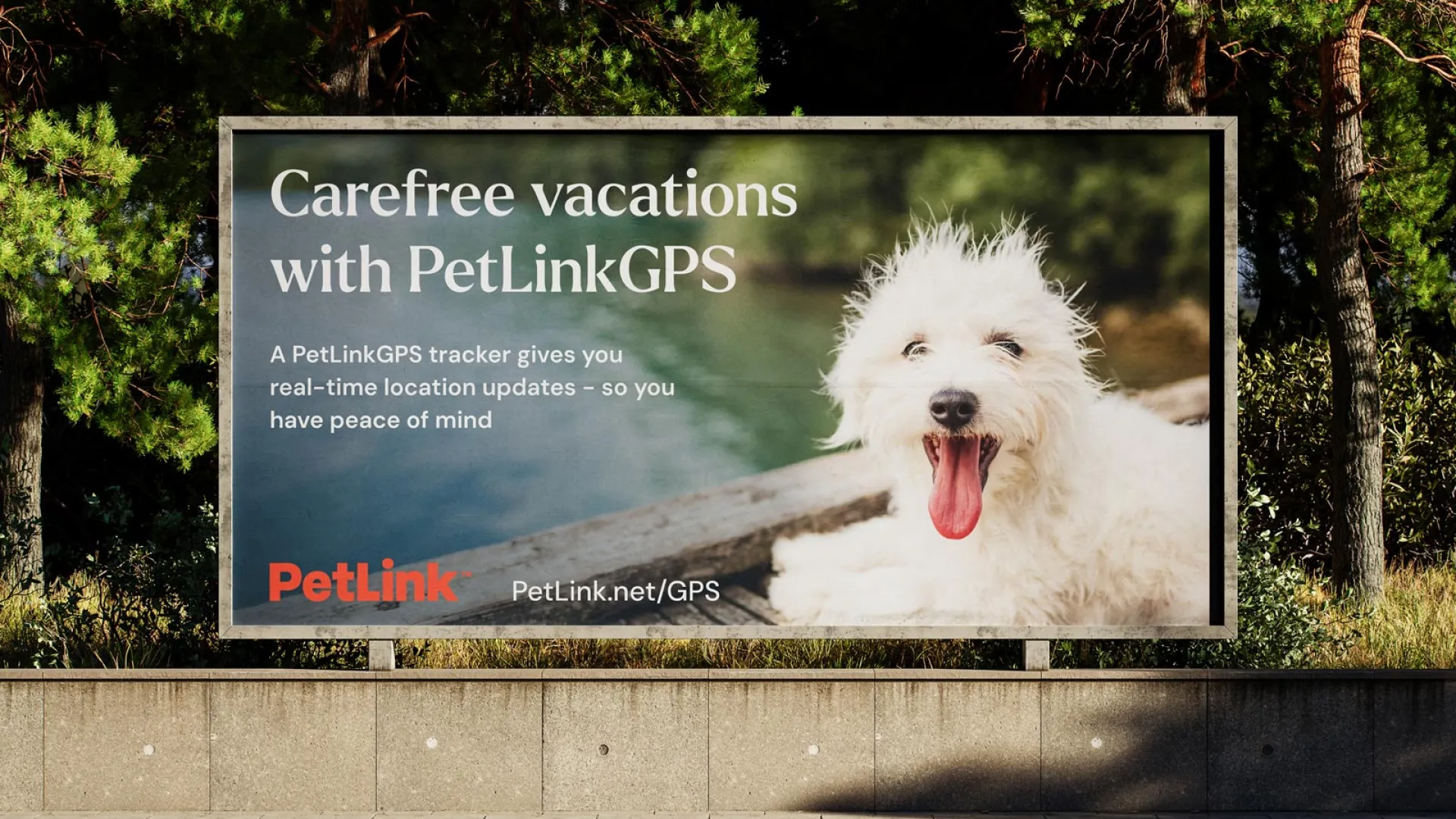 Fluffy white terrier sized dog sticking its tongue out in an image on a PetLinkGPS advert billboard.