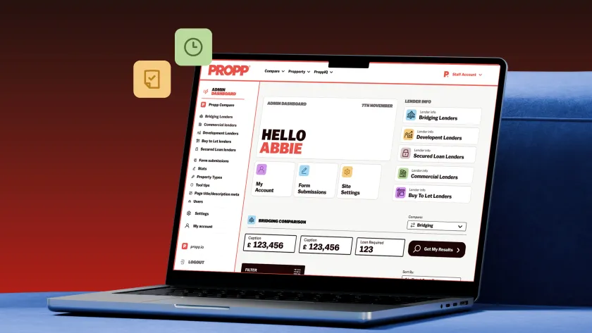 Laptop open on blue sofa displaying admin dashboard page