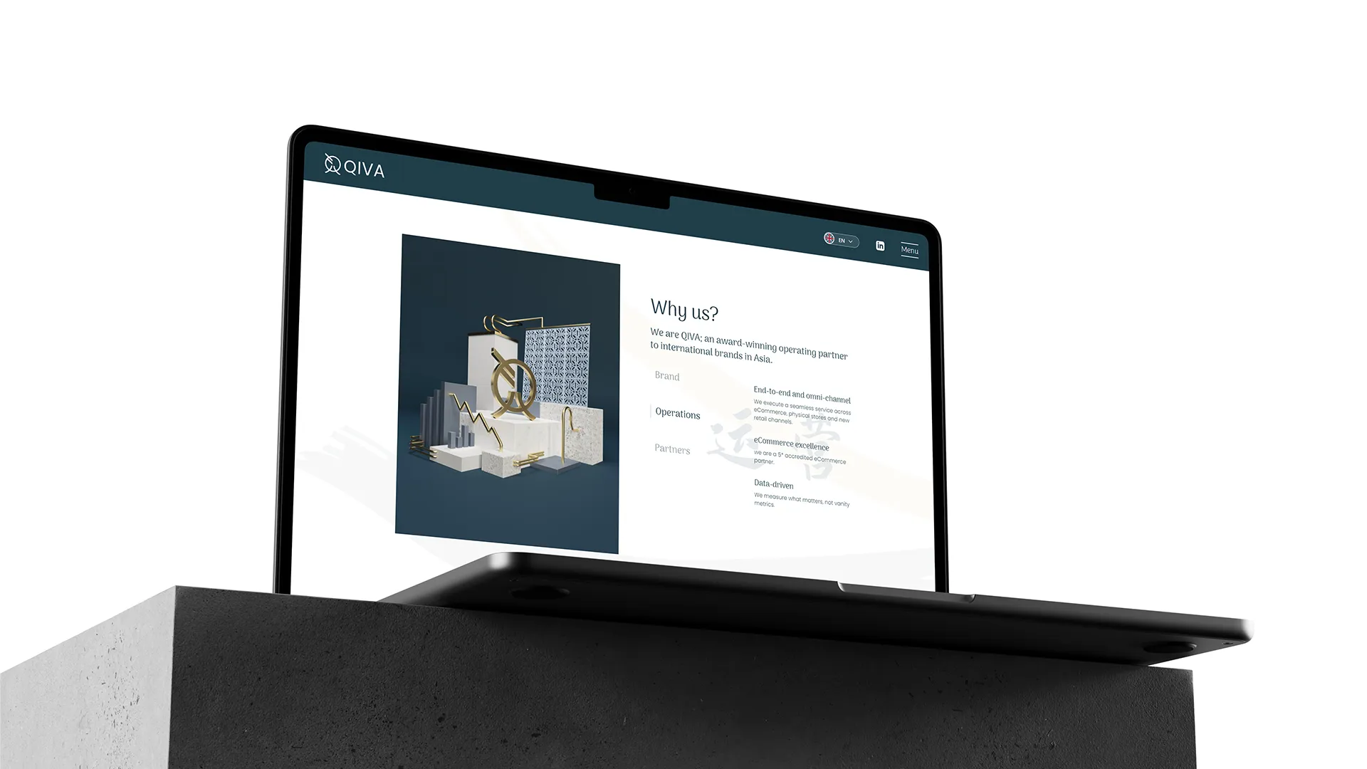 a laptop on a stone pillar showing a website