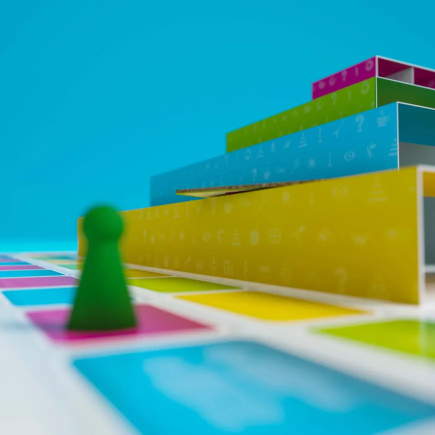 Close up of Quizamid game board tower and player piece.