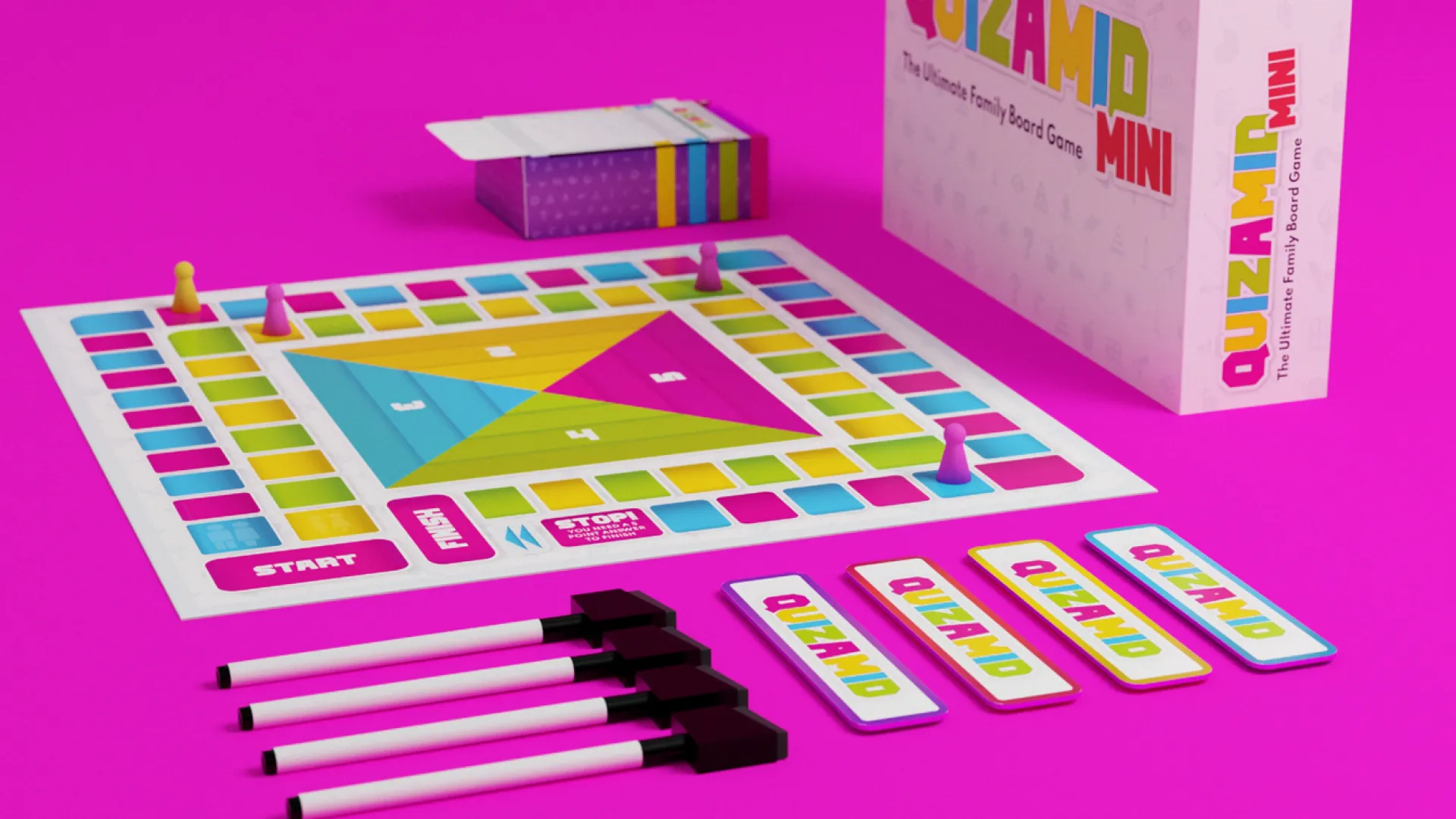 Quizamid board game box and board pieces laid out on hot pink background.