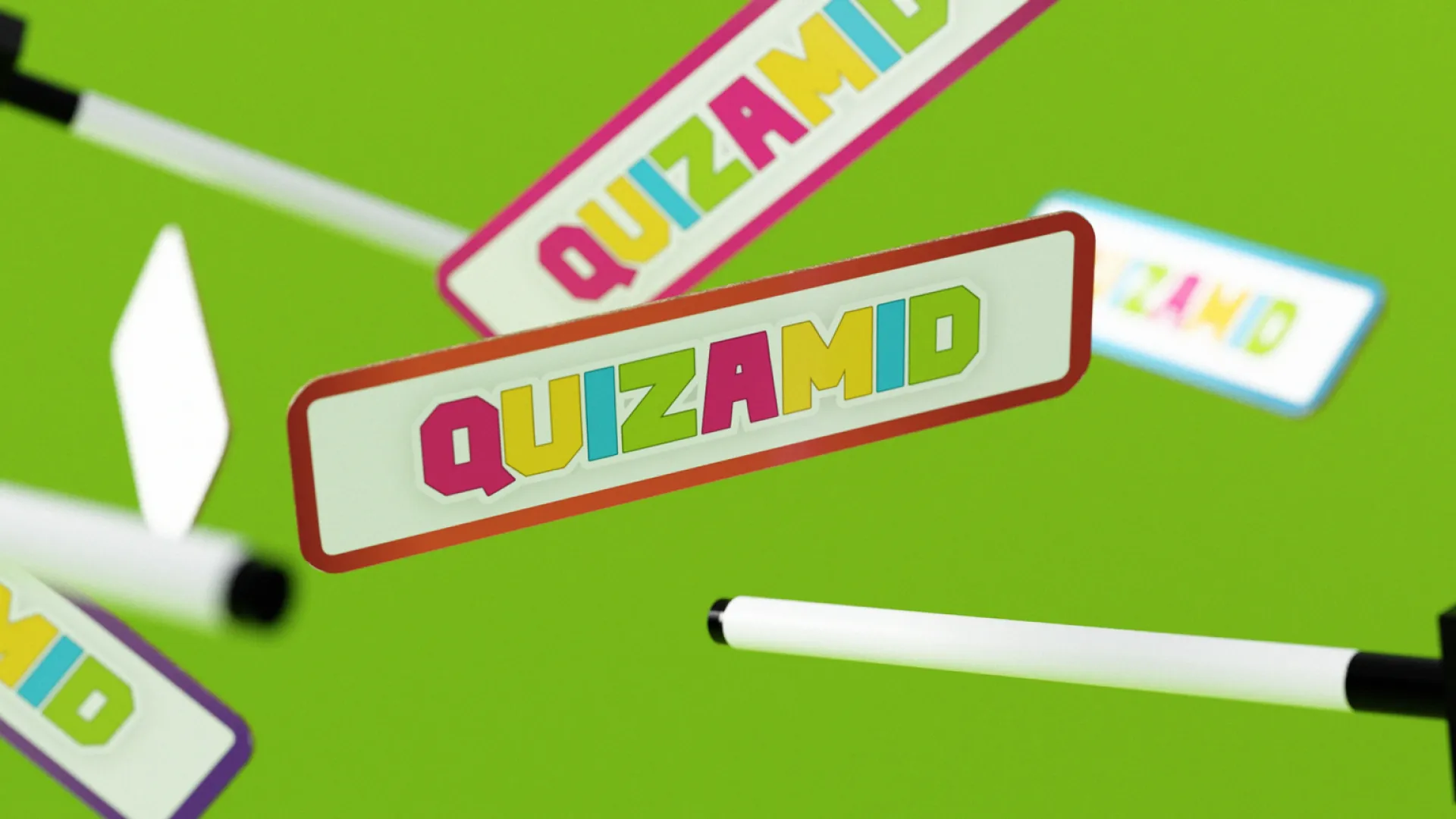 Quizamid marker boards and white board pens scattered in mid air on green background.