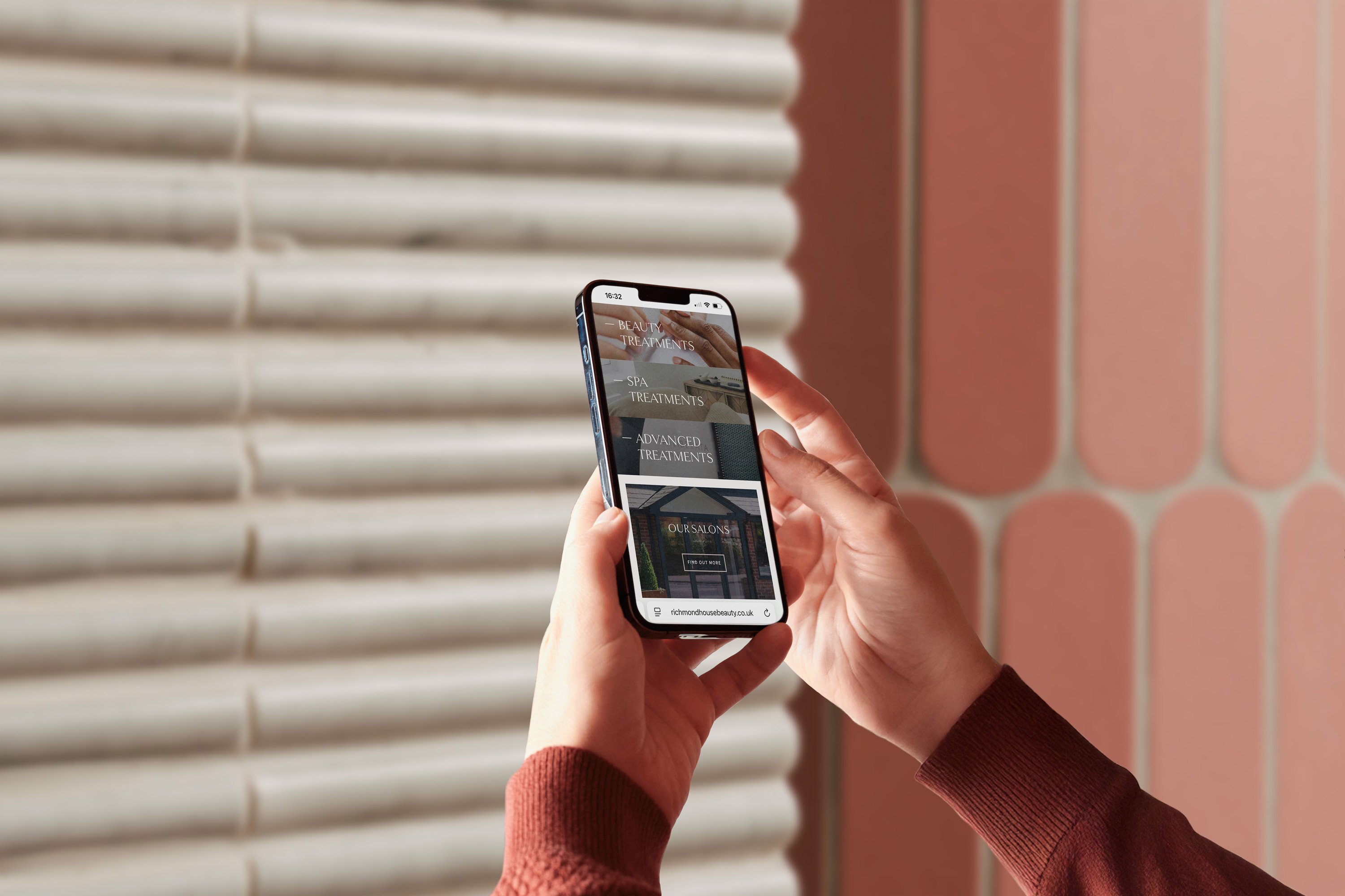 Person holding mobile phone with two hands