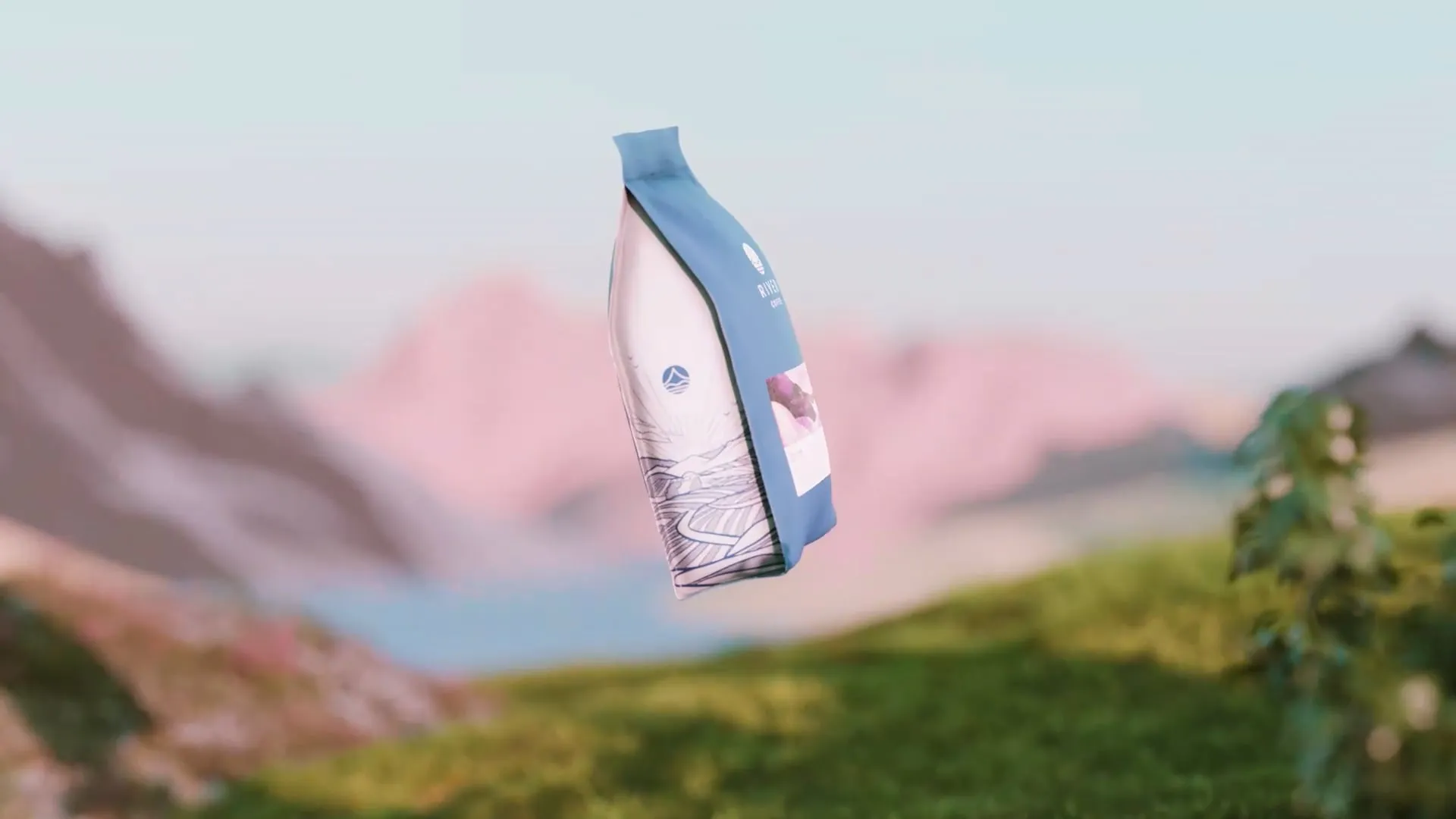 a coffee bag suspended in air amongst mountains and grass