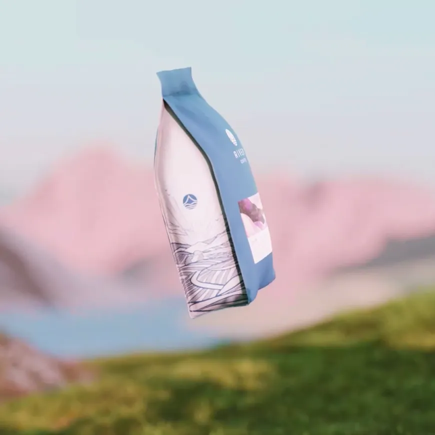 a coffee bag suspended in air amongst mountains and grass