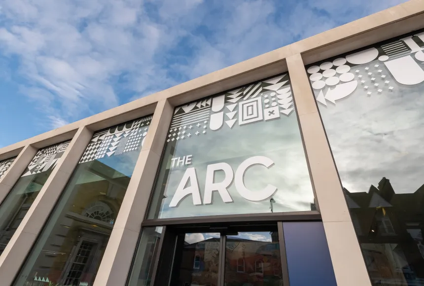 The entrance to The Arc with white writing above the door