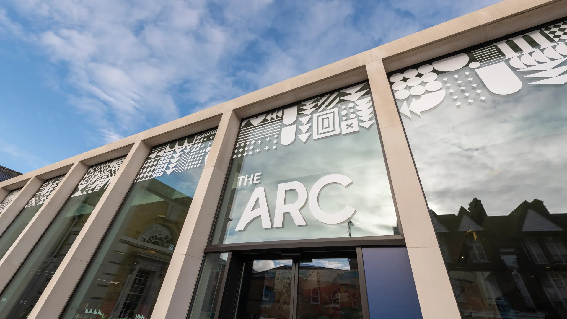 The entrance to The Arc with white writing above the door
