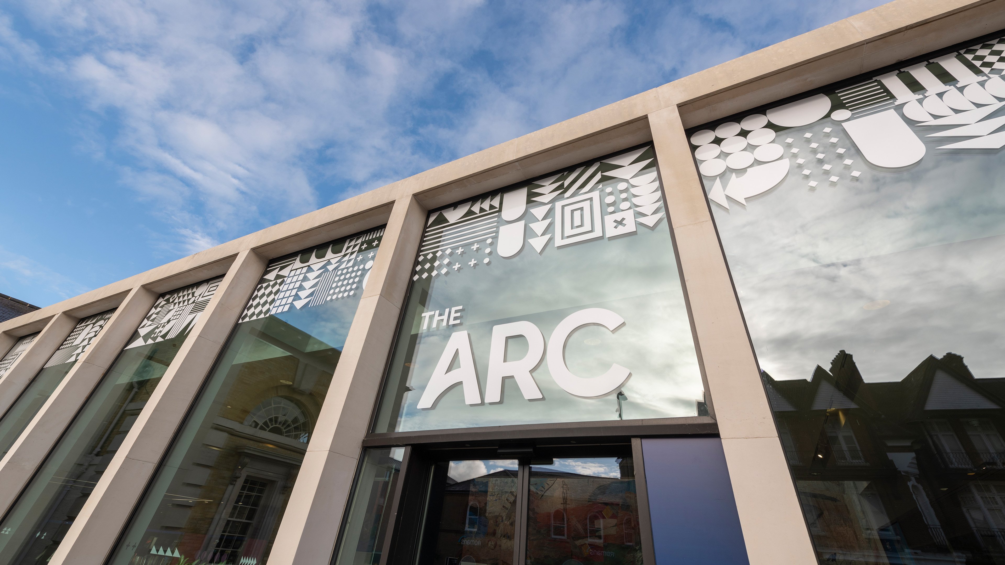 The entrance to The Arc with white writing above the door