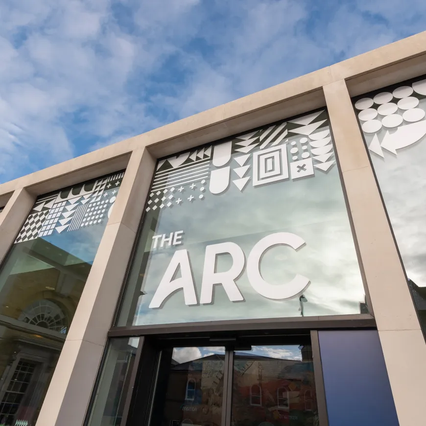The entrance to The Arc with white writing above the door