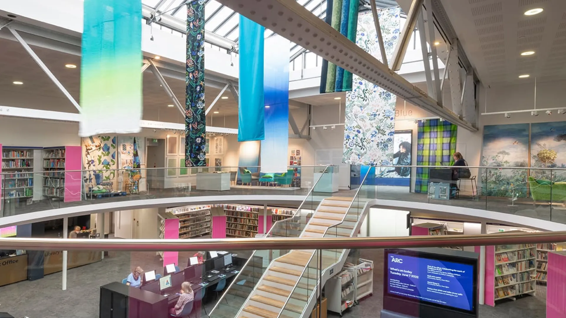A glass wall surrounding the top of a staircase