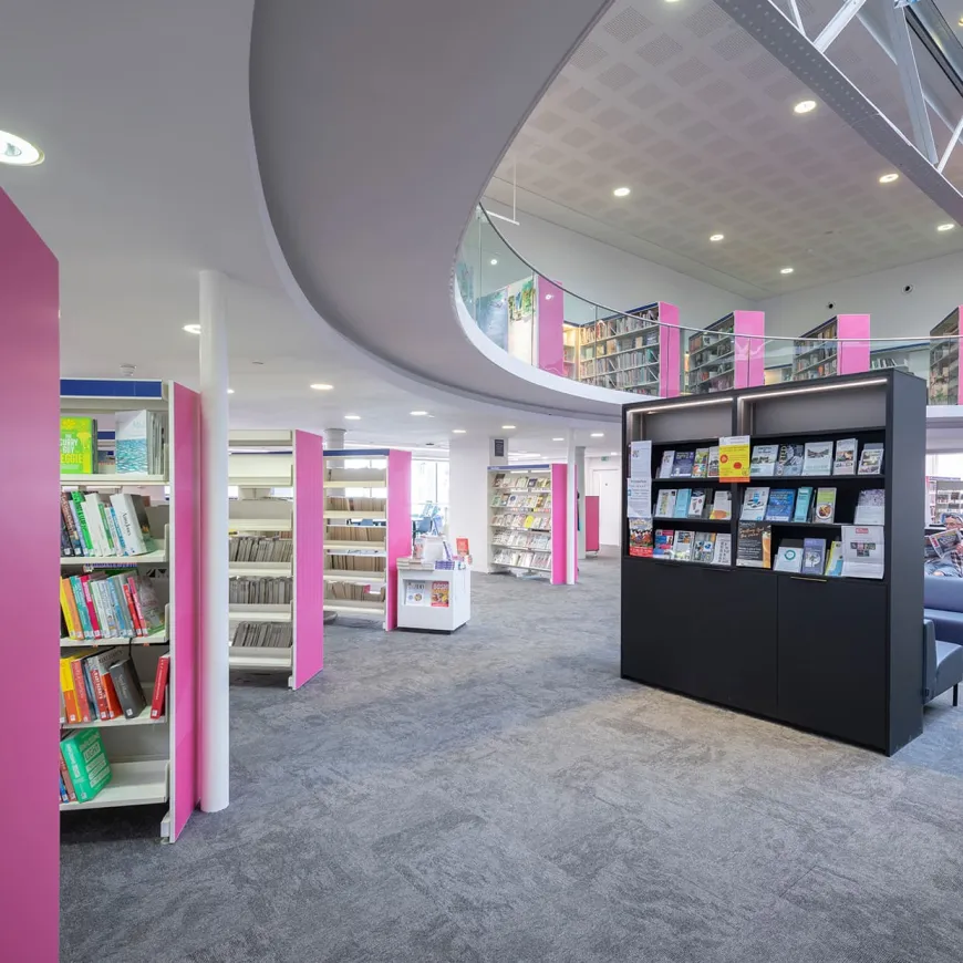 A curved ceiling above book shelves