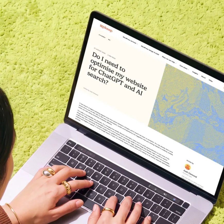 Mockup of a laptop open on the Upkeep insights page, being used by a woman with dark hair on a bright lime green carpet.