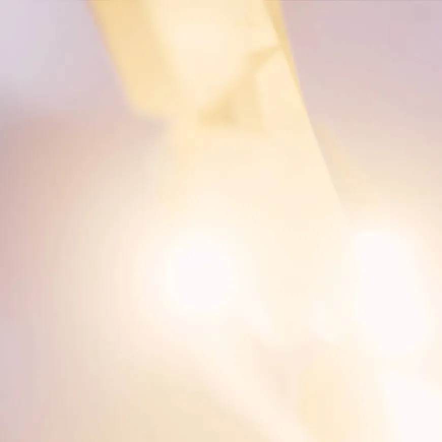 Blurred light in sky, with pink soft hues of light.