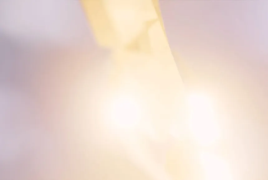 Blurred light in sky, with pink soft hues of light.