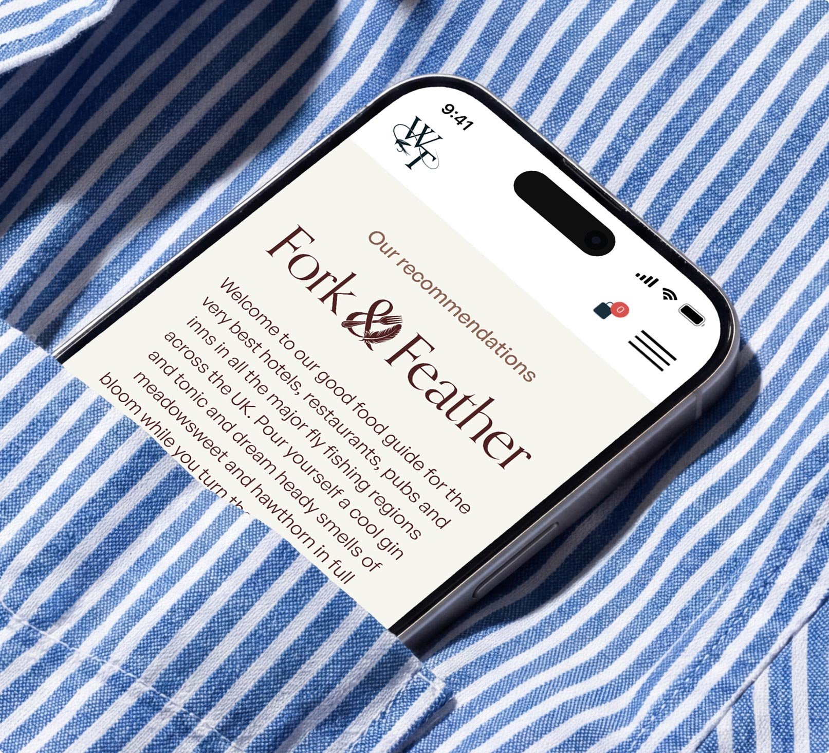 Mobile phone poking out of a blue and white striped shirt pocket.
