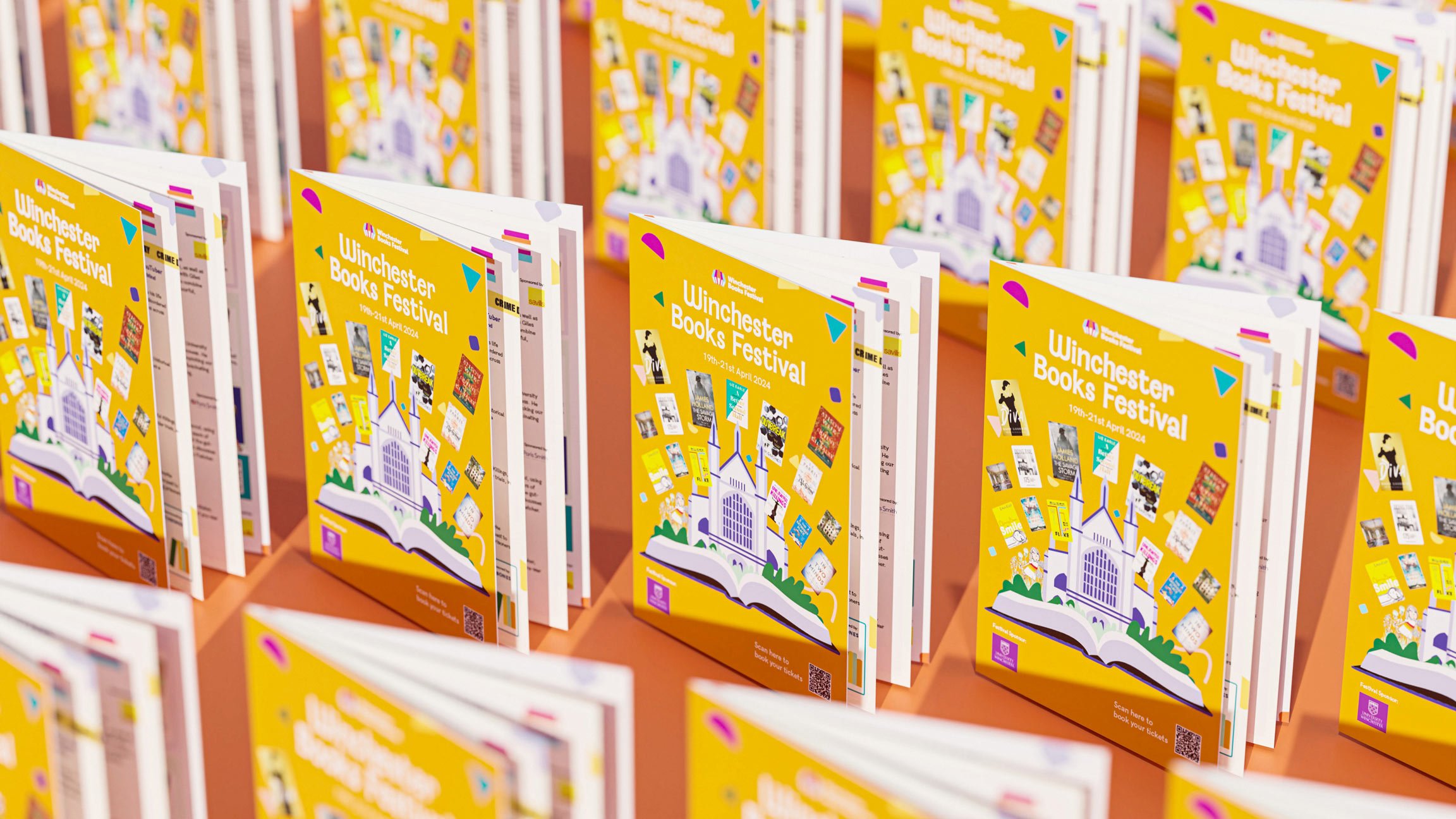 Multiple Winchester books festival booklets stood open repeating rows
