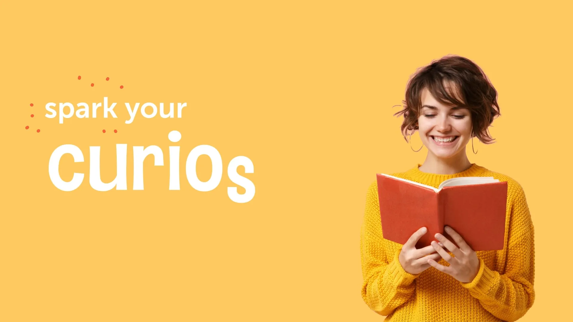 Woman smiling with open orange book on pale orange background