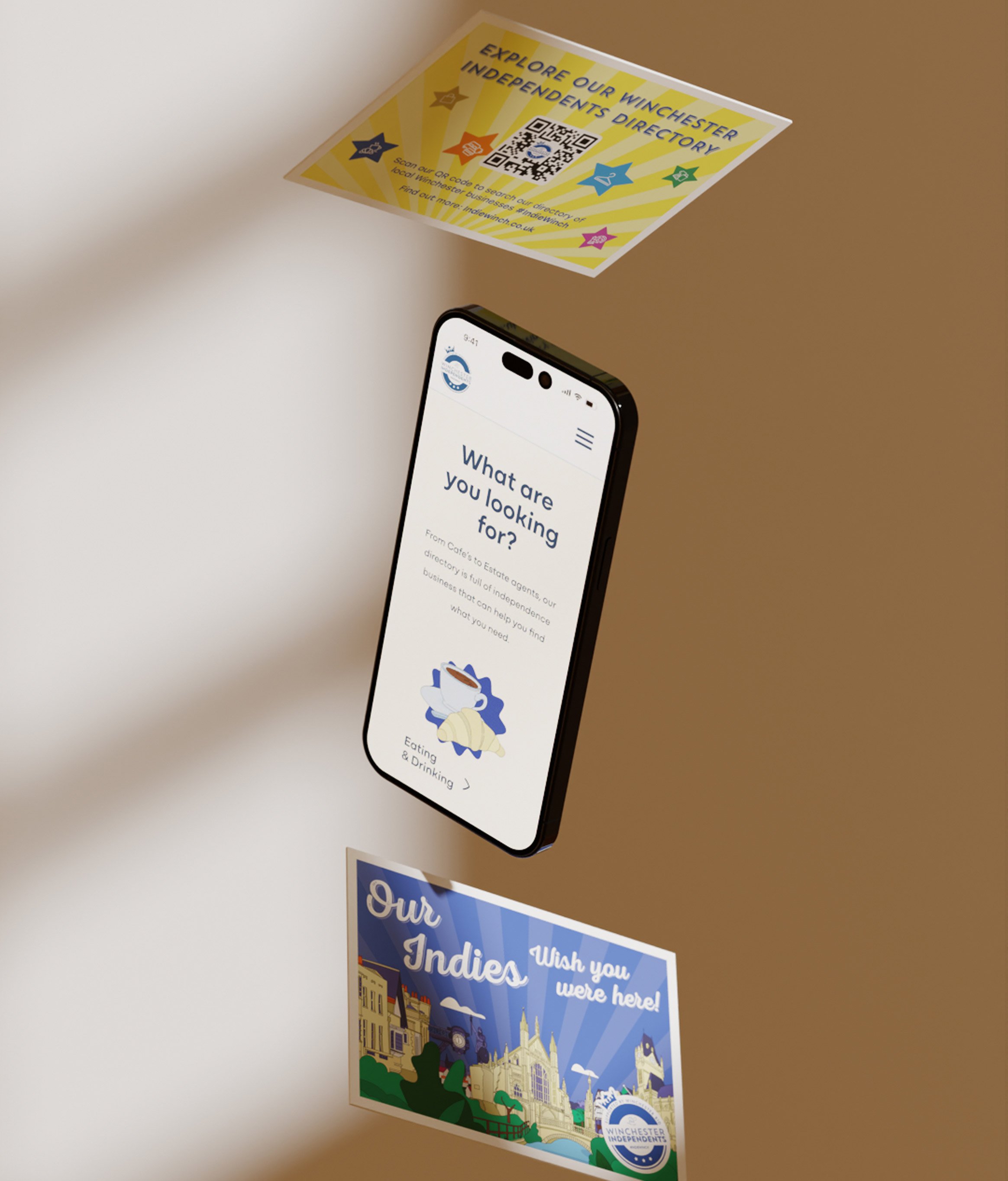 Floating mockup of two colourful postcards with a mobile phone mockup suspended in the middle